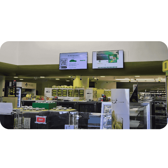 All Greens Dispensary Interior – Medical Marijuana Products Interior of All Greens Dispensary showing display counters with marijuana products and customers browsing.